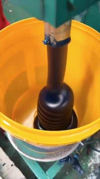 Filling up a bucket with grease