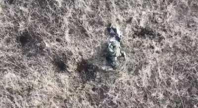 A russian soldier gets hit by a grenade drop from a drone