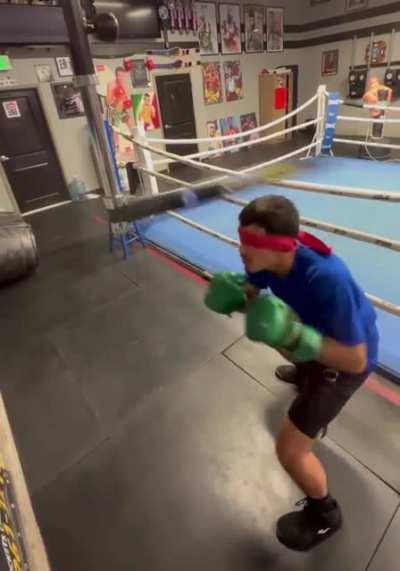 The boy practicing boxing, blindfoldedly is incredible.