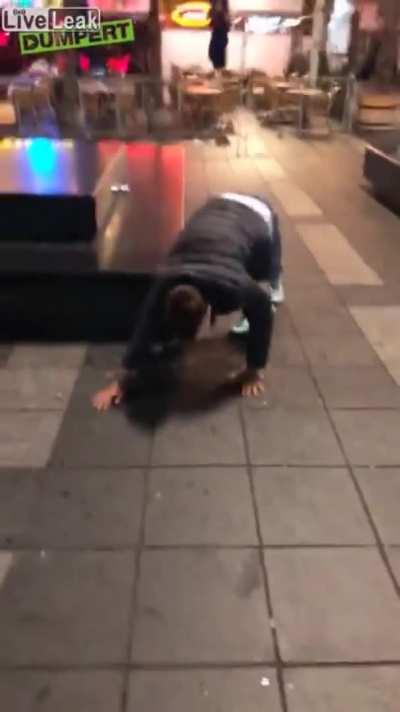 Idiot tries to kick a pigeon and ends up slipping on vomit