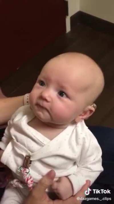 Baby hears her mother's voice for the first time.