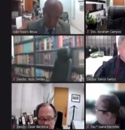 A judge in Brazil used a fake bookshelf for his court sessions and it felt during one of them