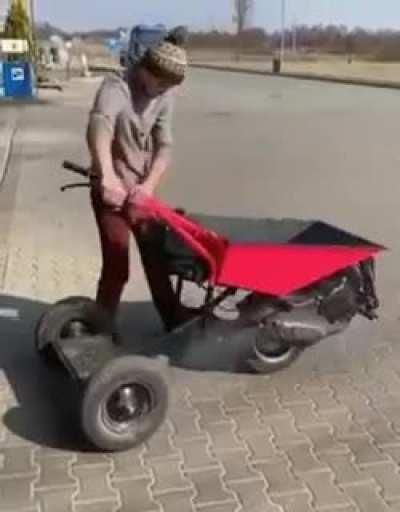 Engine powered wheelbarrow