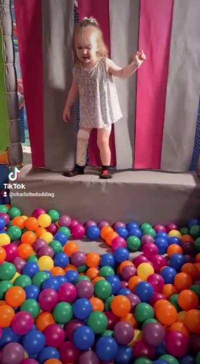 My daughter's great attempt at jumping in the ball pit...