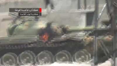 FSA recoilless rifle team hits a Syrian Army tank in the flank - Jobar, Damascus - 7/7/2013