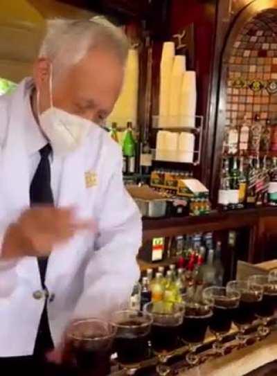 Irish barman making Irish Coffees