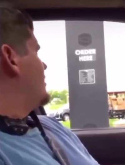 Man wears shock collar at a drive thru.