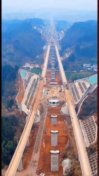 Highway construction through mountains, China.