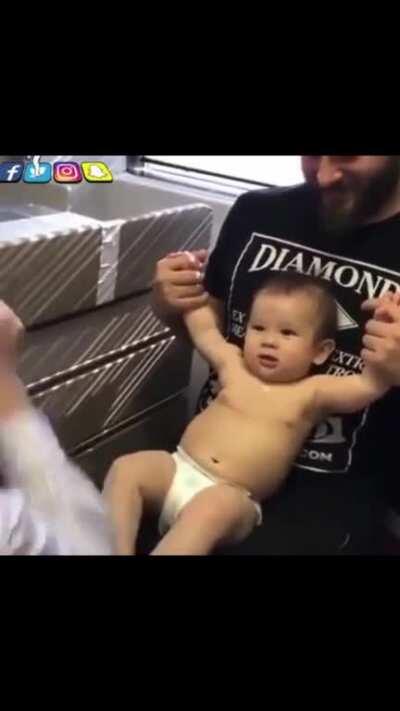 Doctor entertains baby. Baby doesn’t feel needle.