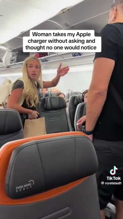 Woman steals phone charger before boarding a flight and gets called out by guy she stole it from