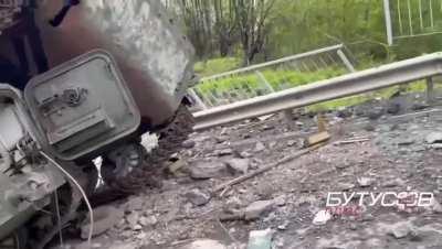 Rus`ka Lozova. Kharkiv region. Two MTLBs overturned at full speed on the blown up bridge. Panic escape of russian troops.