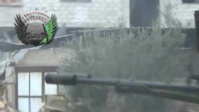 FSA fighters and their technical take a corner to spray rounds at Syrian Army positions - Arbin - January 2013