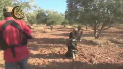 🔥 Badr al-Sham fighters advance behind a captured T-72 in...