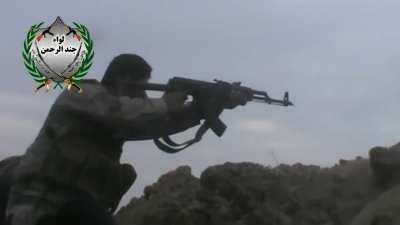 Jindal Rahman Brigade fighters hold a position against Syrian forces during fighthing for Deir ez-Zor Military Airport - 4/16/2014