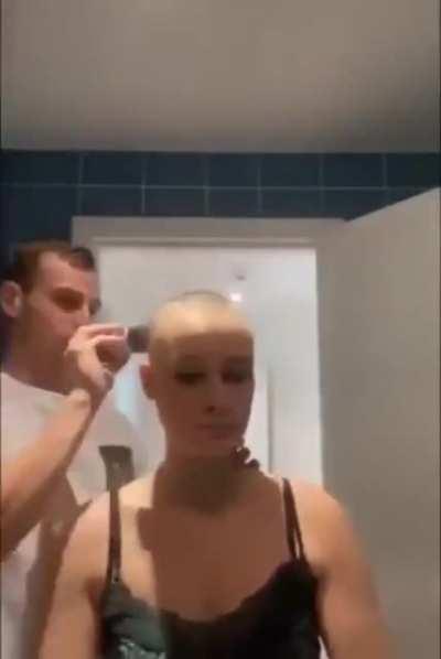 He shaves his head to supports her