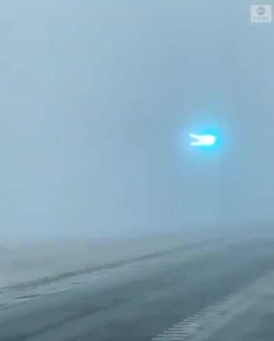 Power lines flashing as blizzard sweeps through Minnesota