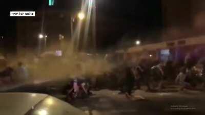 A protester gets hit in the head with a water canon and passes out