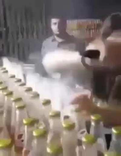 The way this guy opens the bottles