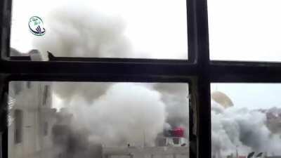 Barrel bomb lands outside the window of an opposition cameraman - Daraya - 1/12/2014