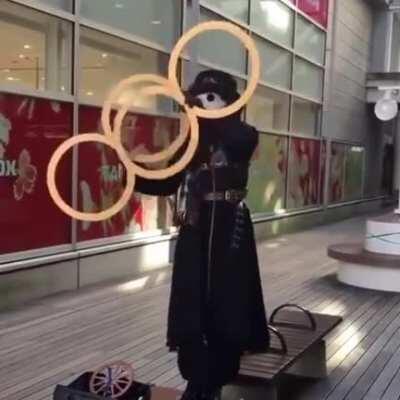 This plague doctor spinning rings. Even the costume is amazing.