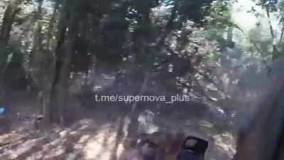 Headcam footage from a Ukrainian soldier clearing a tree line with gunfire after dismounting their vehicle somewhere south of Bakhmut