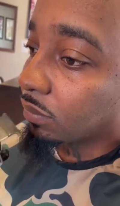 Barber trimming a mustache