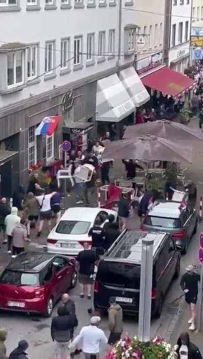 England and Serbia fans clash outside a bar in Gelsenkirchen Germany before the Euros 