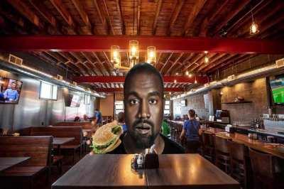 Ye enjoys his burger