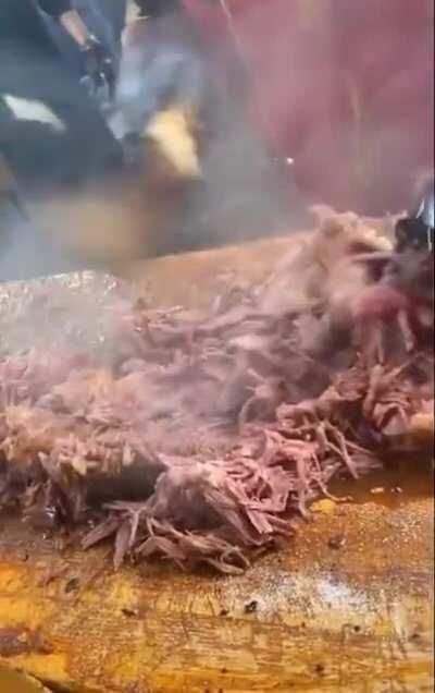 Breaking pulled pork meat down