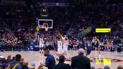 New Orleans Pelicans forward Brandon Ingram picks up the loose ball and makes a no-look halfcourt shot to beat the halftime buzzer