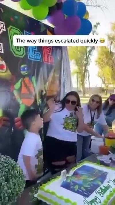 Mom smashing her kid's face in his birthday cake