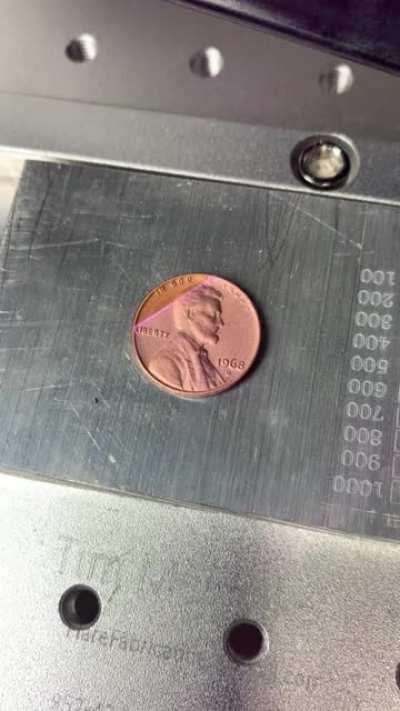 Laser cleaning a penny