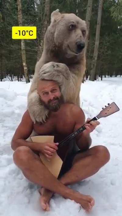 A strong Russian man with a handsome bear.