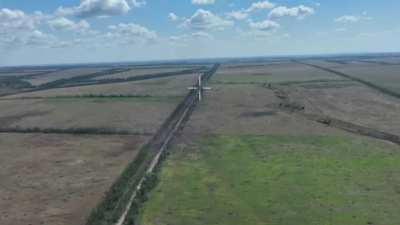 Drone footage claimed to show a Russian soldier walking a few steps behind his comrade before shooting him in the back, filmed by the aerial reconnaissance of the 135th Battalion of the 114th Territorial Defense Brigade