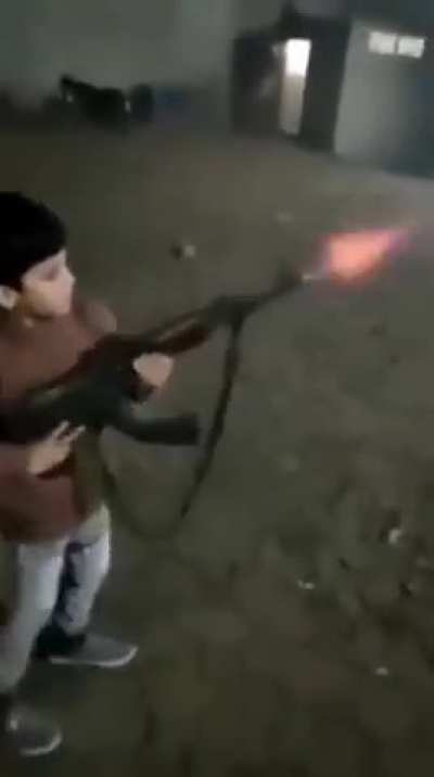 Syrian child shooting a ak47 then killed by a sniper