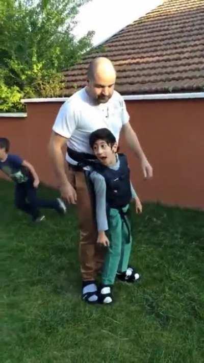 This dad lets his son with cerebral palsy experience the fun of sport by wearing a Harness