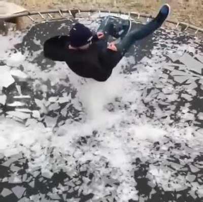 Breaking ice on a trampoline