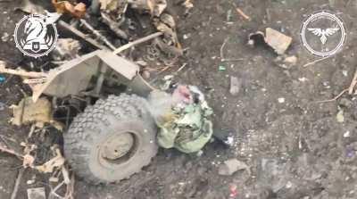 Russian Soldier Hiding by a Destroyed Vehicle is hit by a Ukrainian FPV Drone (March 2024)