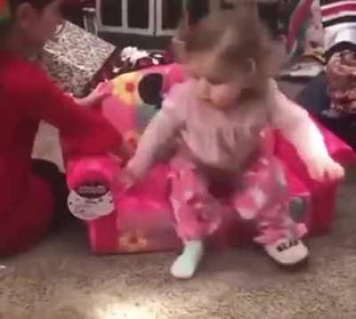 This little girl is so excited about her Minnie chair