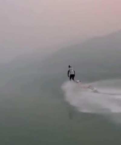 Glassy lake surface allows bro to ghost his wave runner.