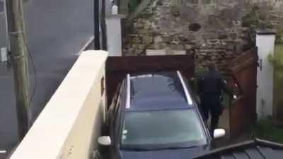 French police deal with a women wielding a shotgun