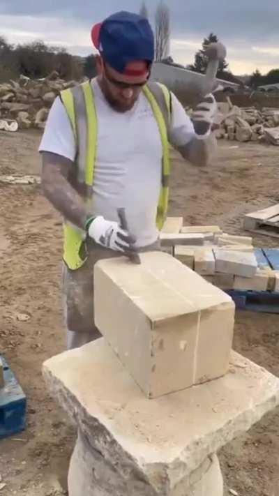 Cutting perfect rock with chisel and hammer 