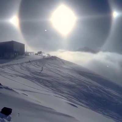 A breathtaking Sun halo over the Austrian Alps caused by ice crystals in the air refracting light.