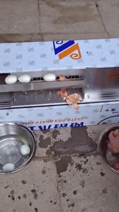 A boiled egg skin-peeling machine at work