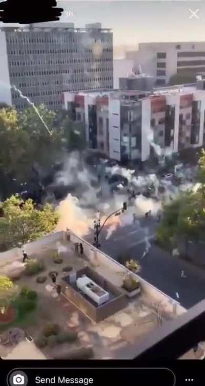 Tear gas fired at protesters in California...