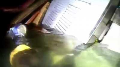 Divers search the wreckage of a boat 3 days after it sank