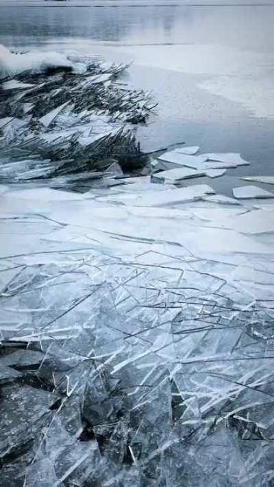 Ice sheet being pushed by 10 mph wind, Lake Superior