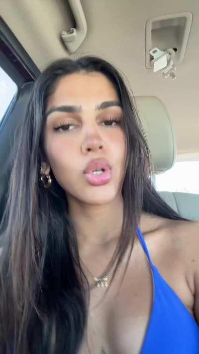 Blue bikini top in car