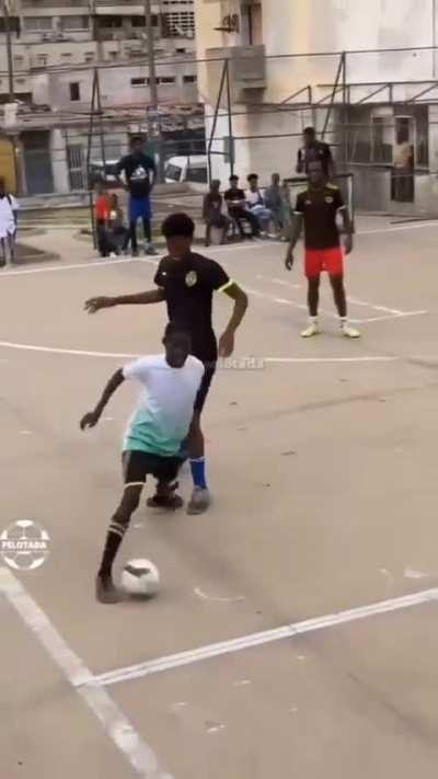 Boys in Angola showing their range of skills while playing soccer