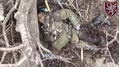 Ukrainian drone drops a grenade on a wounded Russian soldier (looks like an African mercenary)